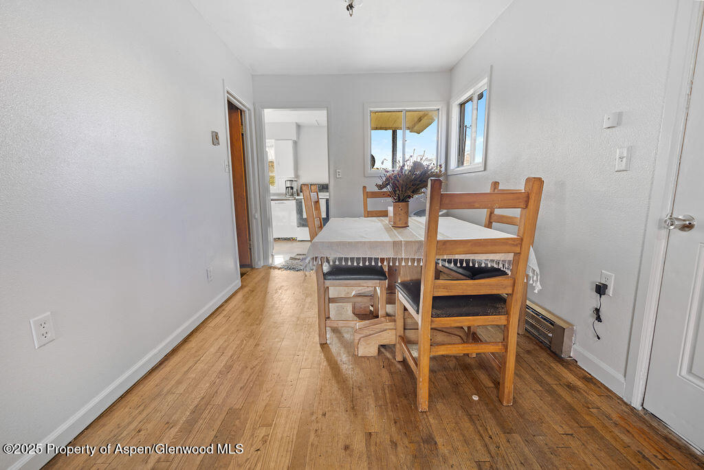 3362 County Road 7 Craig, CO 81625 - Photo 15 of 36 a view of a dining room with furniture and wooden floor