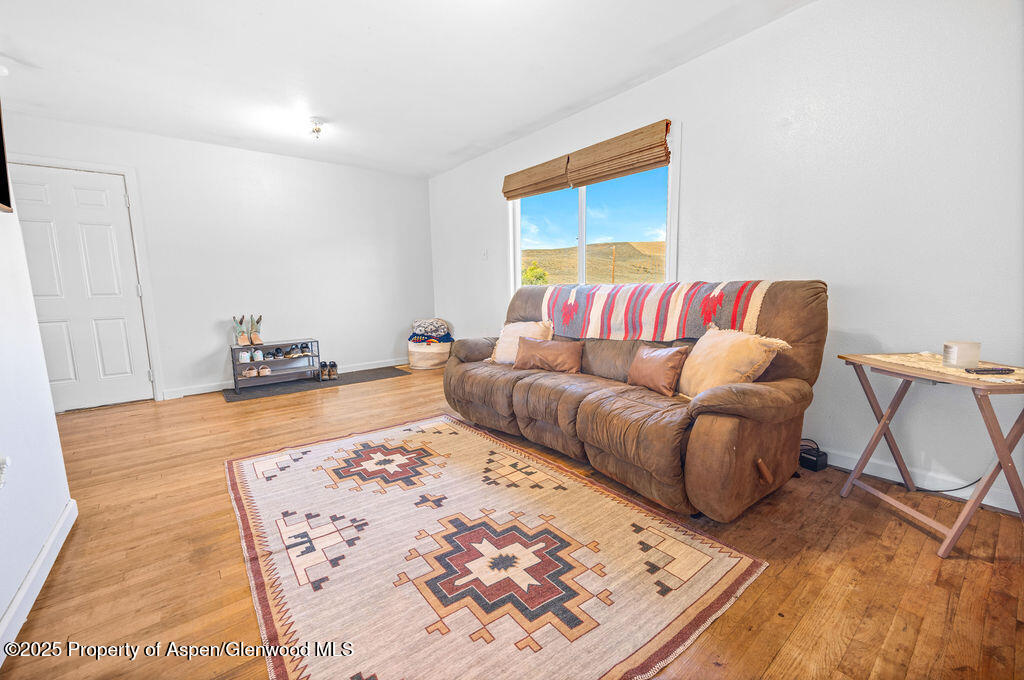 3362 County Road 7 Craig, CO 81625 - Photo 16 of 36 a living room with a couch and a coffee table