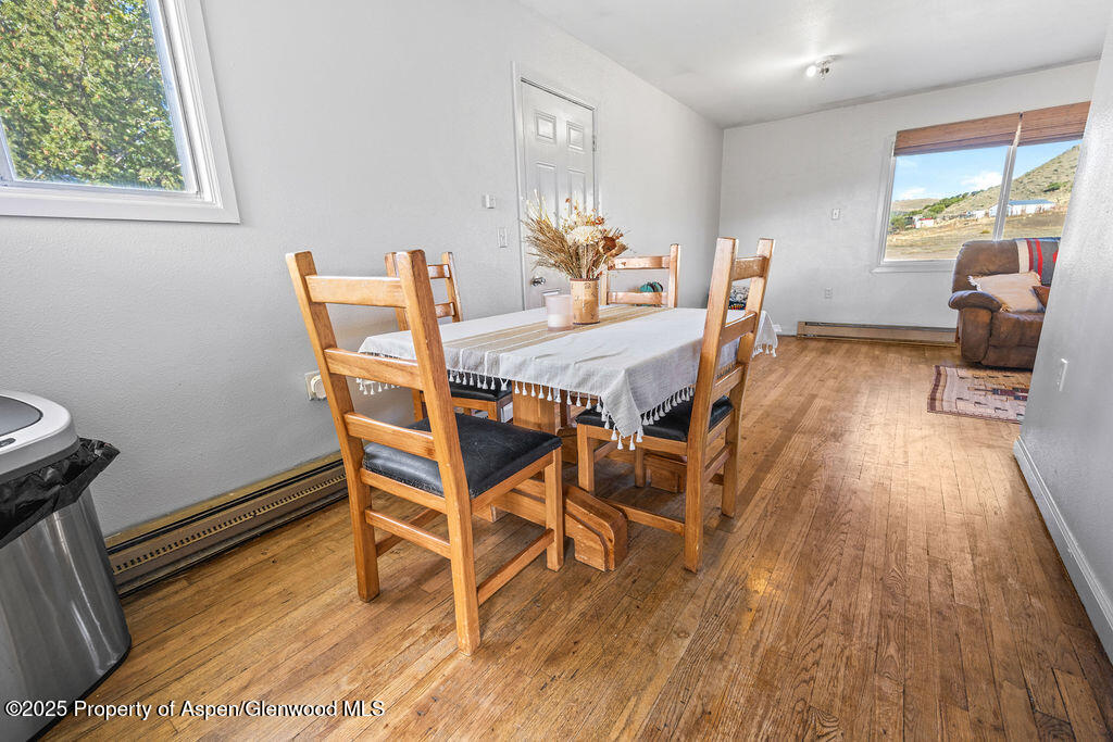 3362 County Road 7 Craig, CO 81625 - Photo 17 of 36 a dining room with furniture and wooden floor