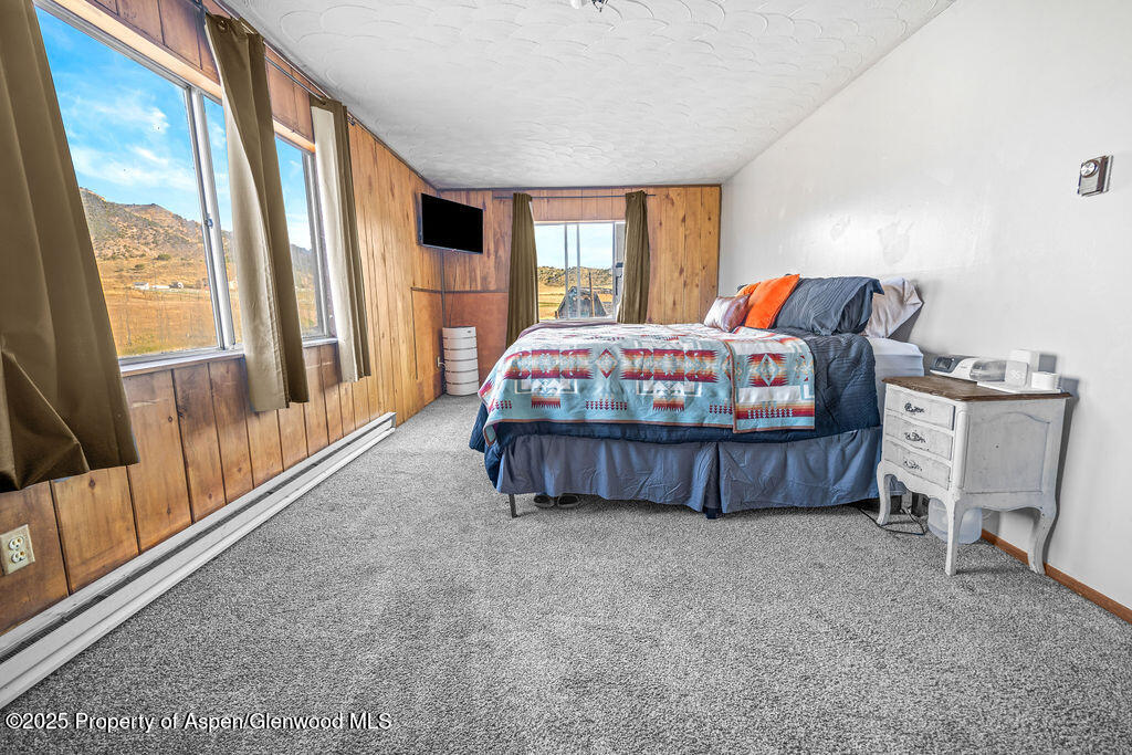 3362 County Road 7 Craig, CO 81625 - Photo 22 of 36 a bedroom with a bed table and window