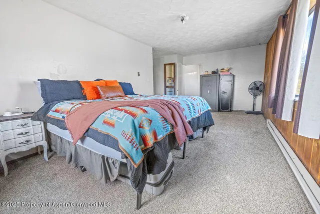 a room with a bed and a window