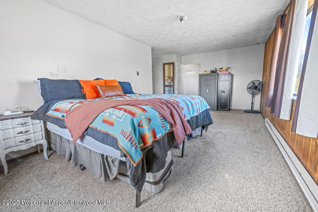 3362 County Road 7 Craig, CO 81625 - Photo 23 of 36 a bedroom with a bed and a cabinets