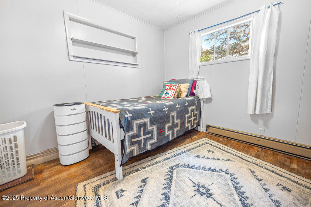 3362 County Road 7 Craig, CO 81625 - Photo 25 of 36 a bedroom with a bed and a window