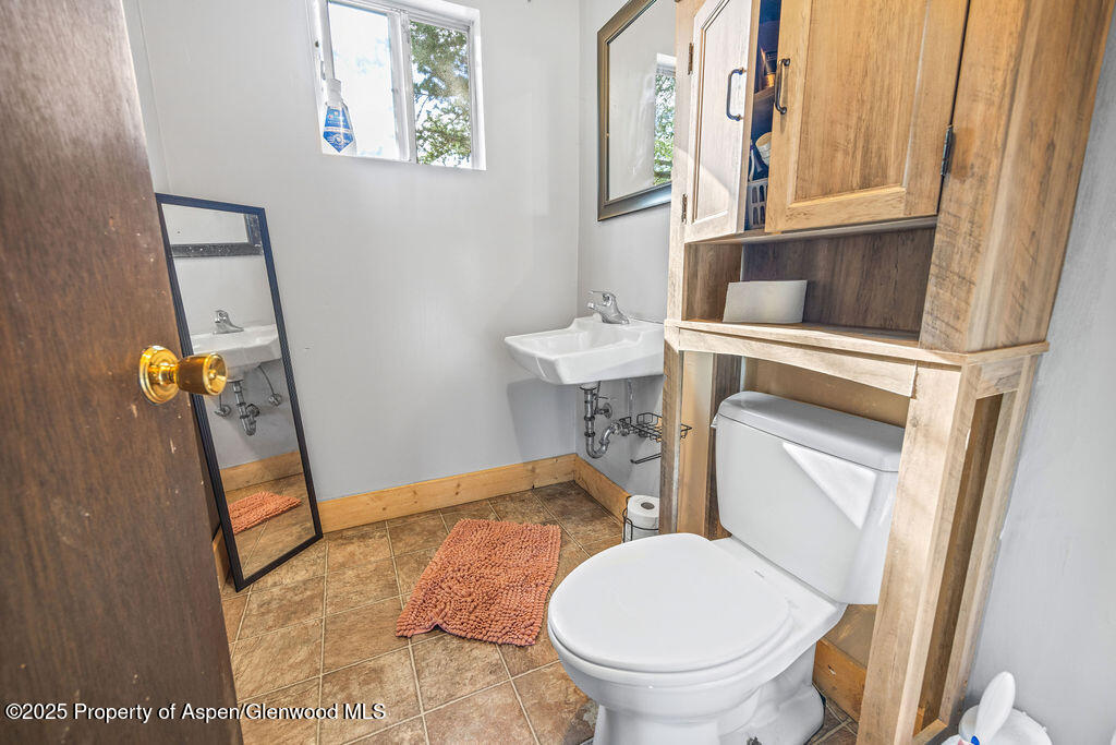 3362 County Road 7 Craig, CO 81625 - Photo 26 of 36 a bathroom with a sink and a toilet