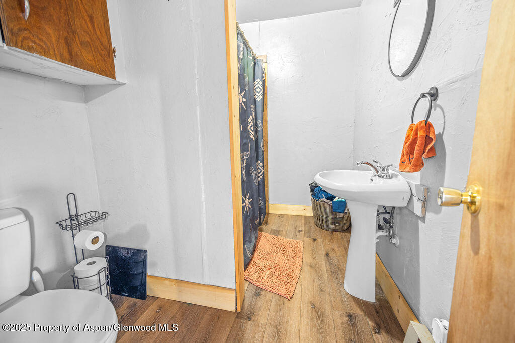 3362 County Road 7 Craig, CO 81625 - Photo 27 of 36 a bathroom with a sink toilet and shower
