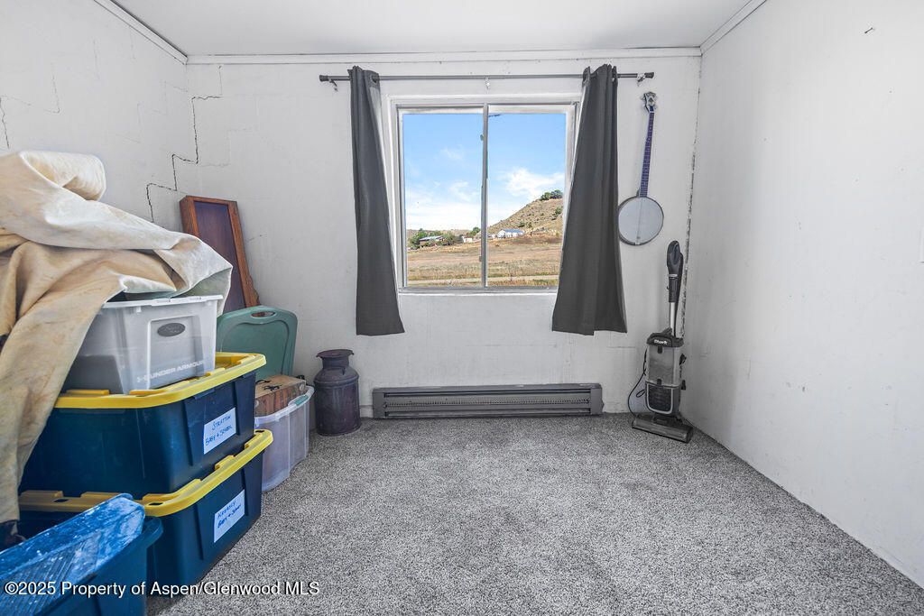 3362 County Road 7 Craig, CO 81625 - Photo 30 of 36 a room that has a bed and a window
