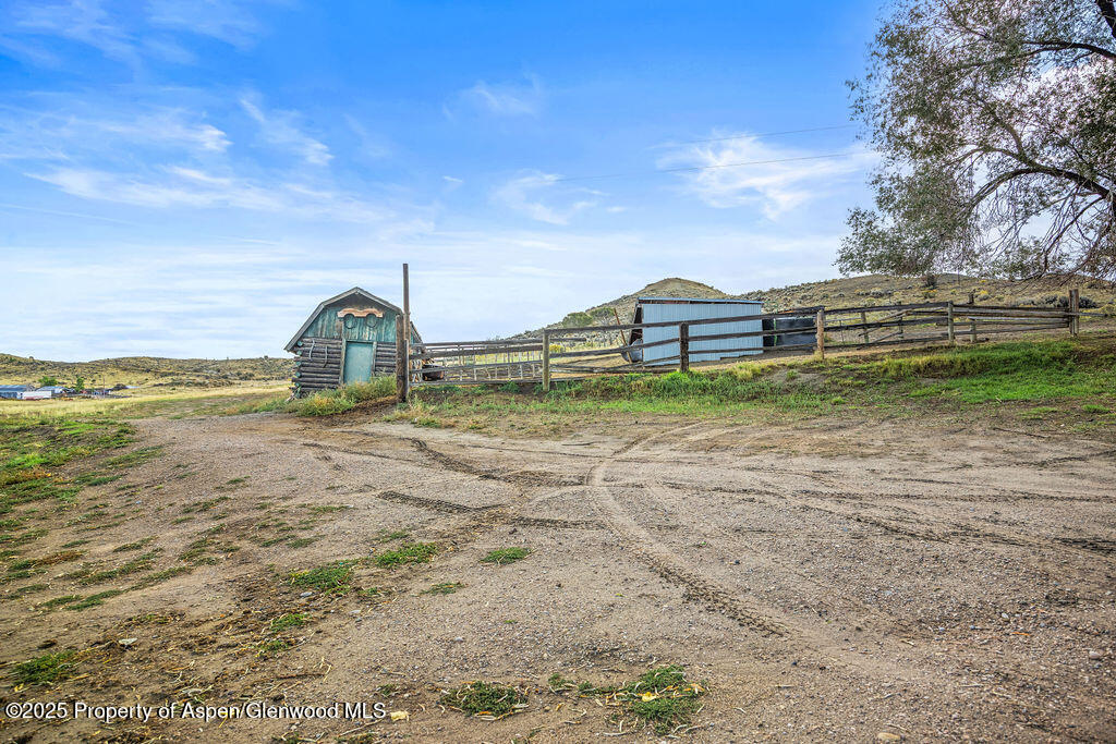 3362 County Road 7 Craig, CO 81625 - Photo 9 of 36 a view of a lake with a big yard and potted plants