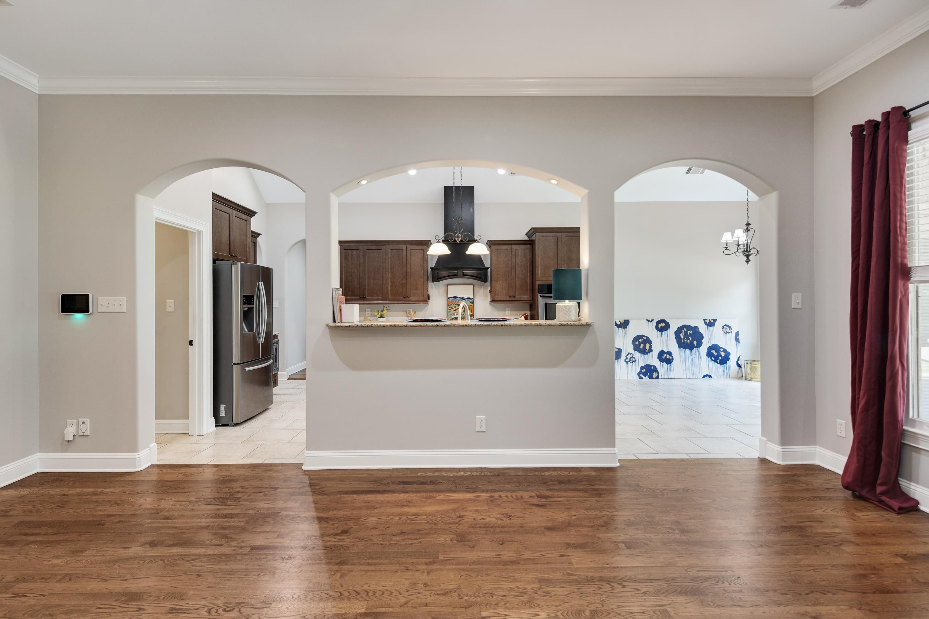 9028 Osborntown Road Arlington, TN 38002 - Photo 12 of 40 a view of living room with kitchen island and wooden floor