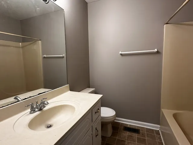 a bathroom with a sink and a toilet
