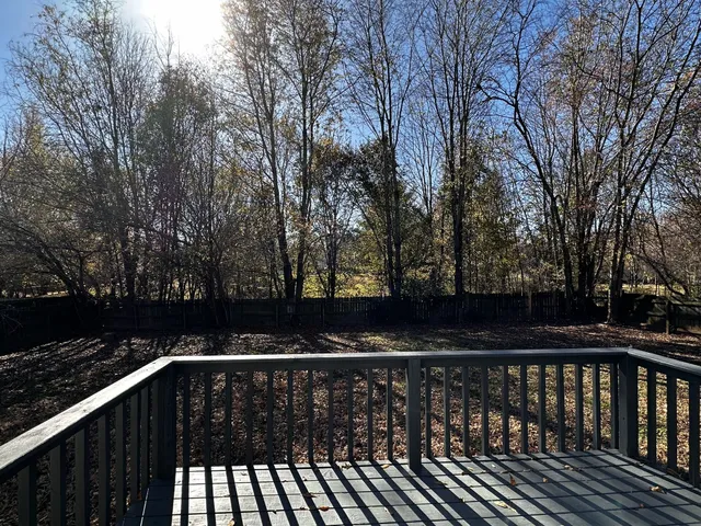a view of deck with a trees
