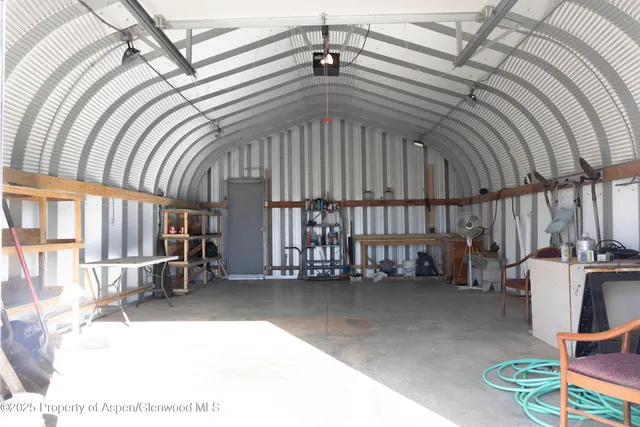 a dining room with furniture and a window