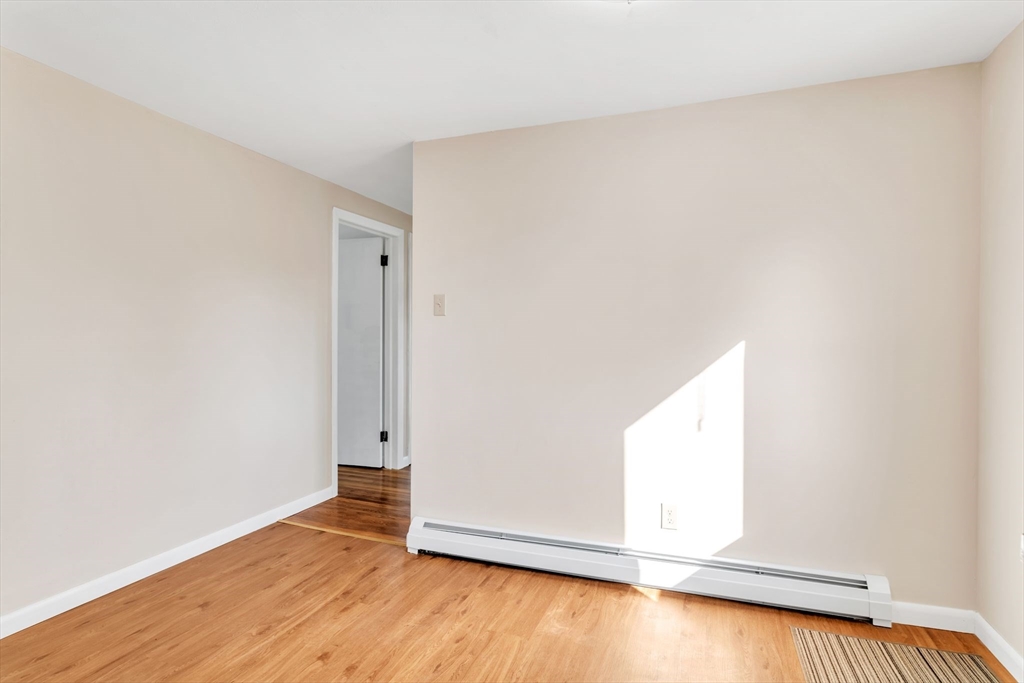 127 Drexel Street Springfield, MA 01104 - Photo 16 of 41 an empty room with wooden floor