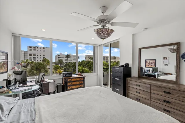 a bed room with a bed and a large mirror