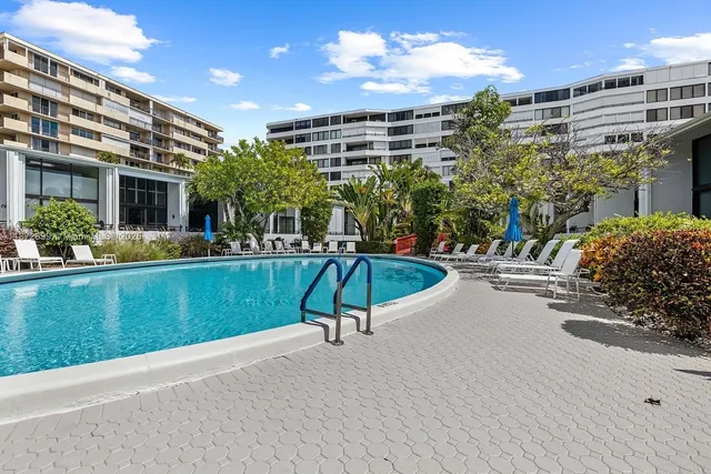 a view of a swimming pool with a patio