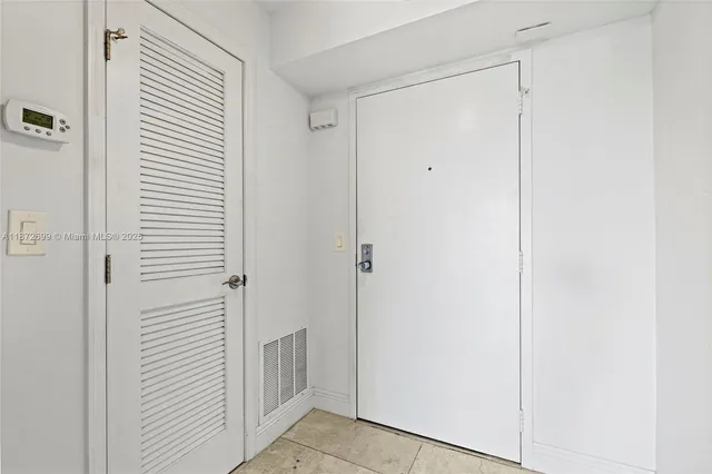 a view of a hallway with closet area