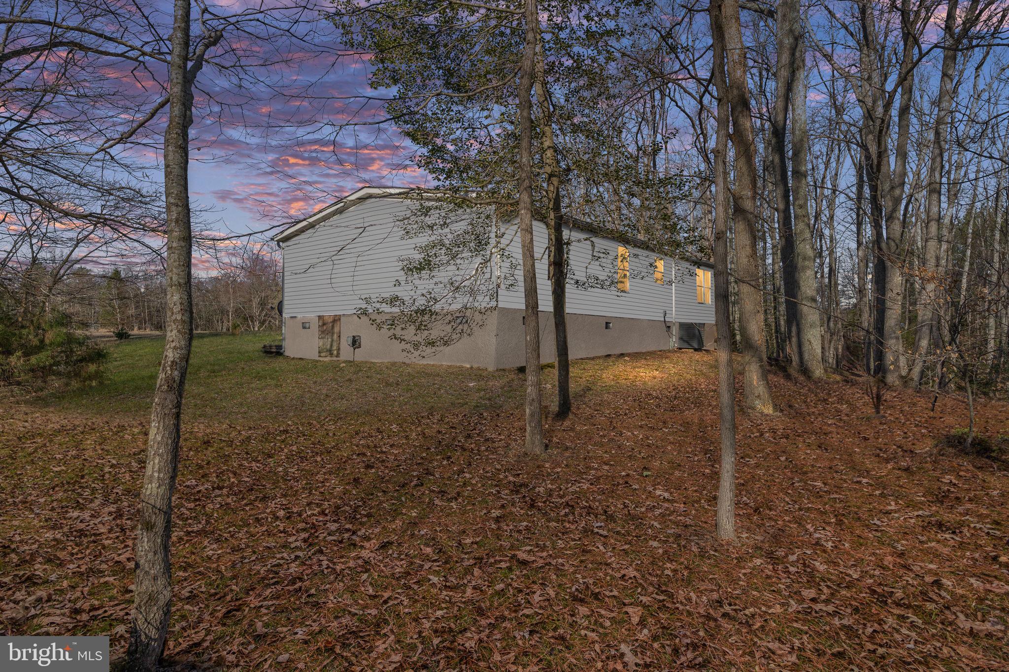 14227 Springfield Lane King George, VA 22485 - Photo 5 of 22 Serene home nestled in wooded retreat.