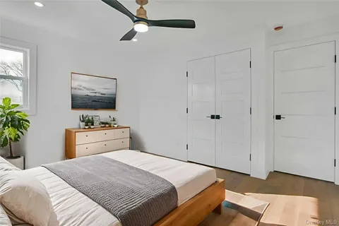 a bedroom with a bed and a dresser