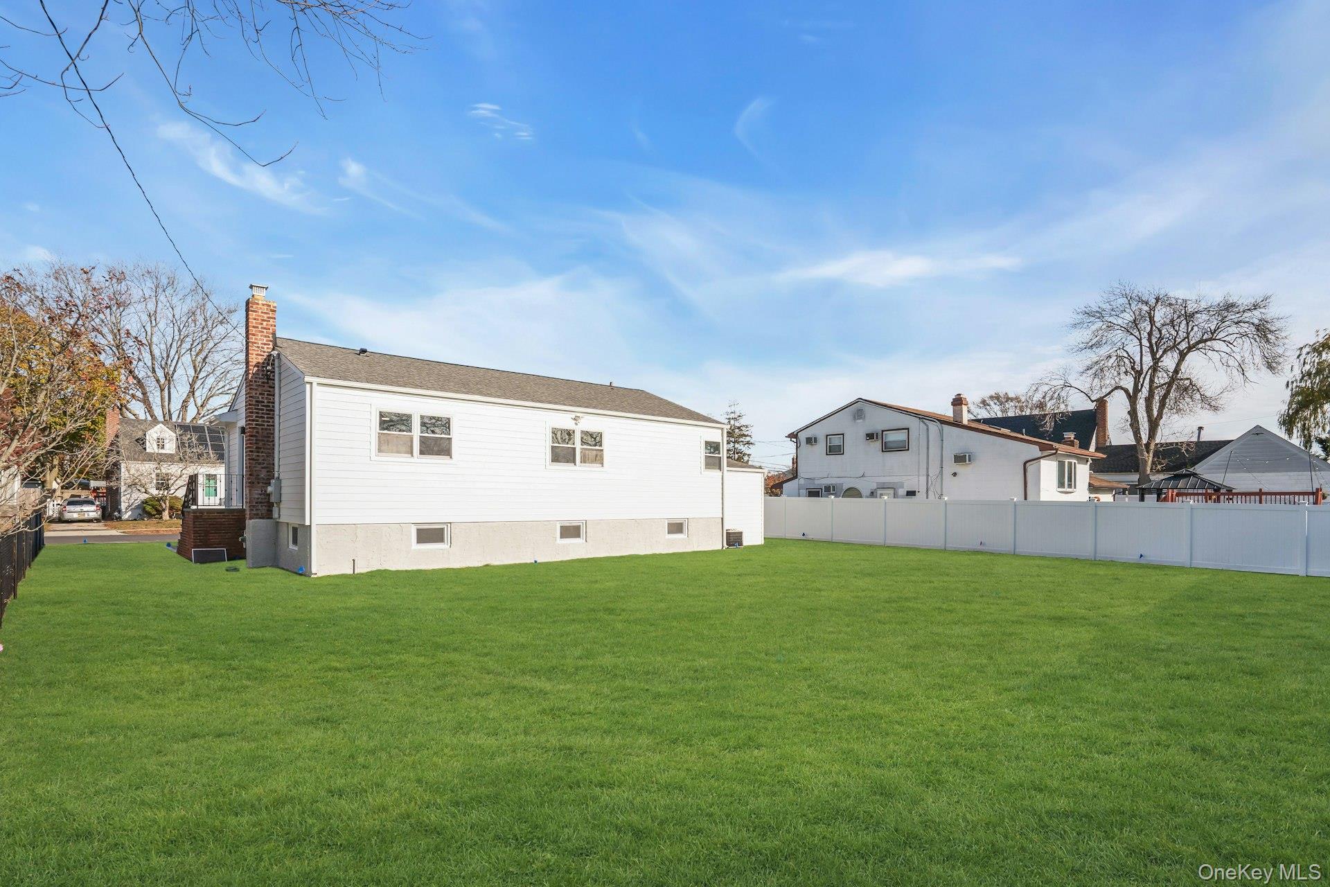 243 Lido Parkway Lindenhurst, NY 11757 - Photo 42 of 46 a view of a house with a yard