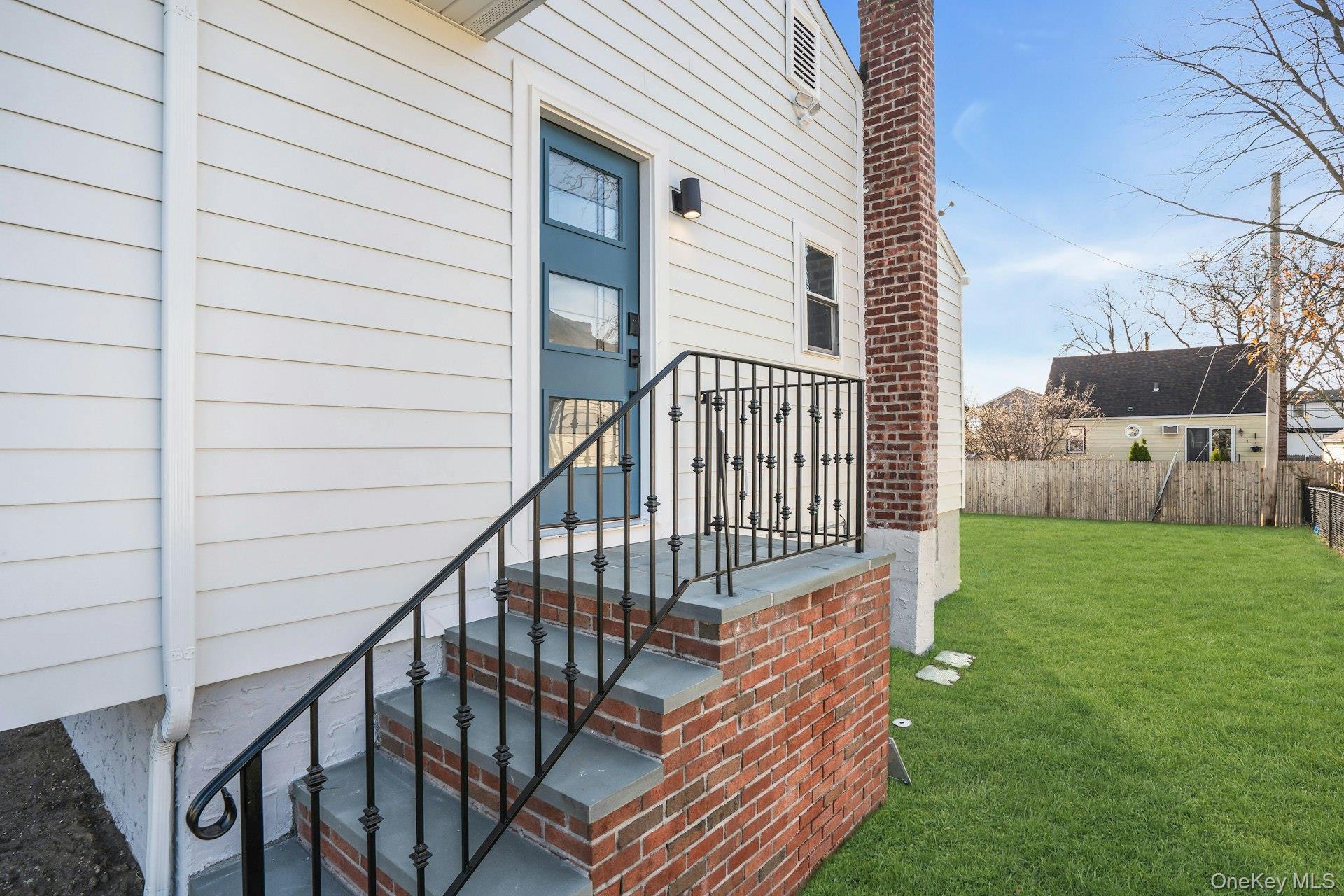 243 Lido Parkway Lindenhurst, NY 11757 - Photo 44 of 46 a view of a house with backyard and deck