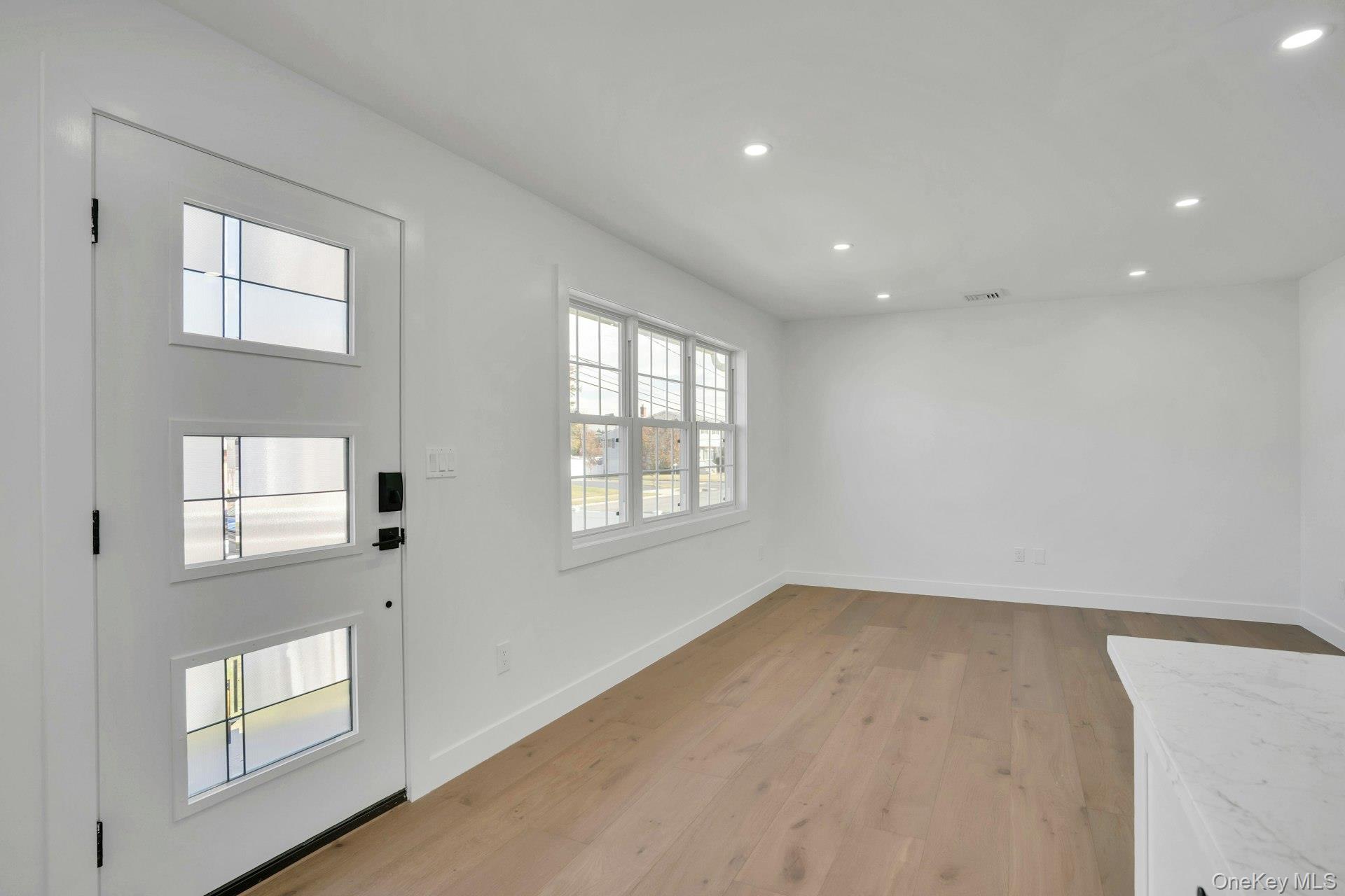 243 Lido Parkway Lindenhurst, NY 11757 - Photo 7 of 46 a view of an empty room with a window