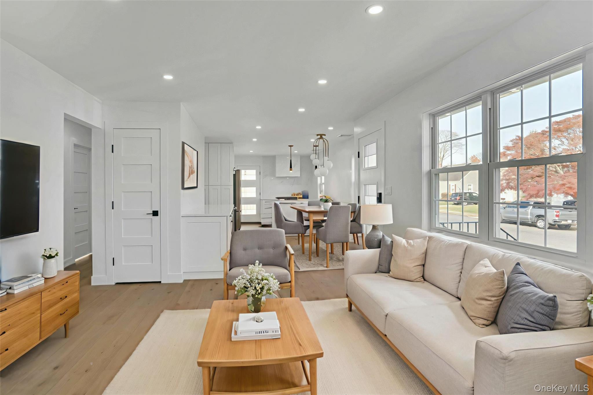 243 Lido Parkway Lindenhurst, NY 11757 - Photo 9 of 46 a living room with furniture and a flat screen tv