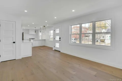 a view of large kitchen with stainless steel appliances cabinets