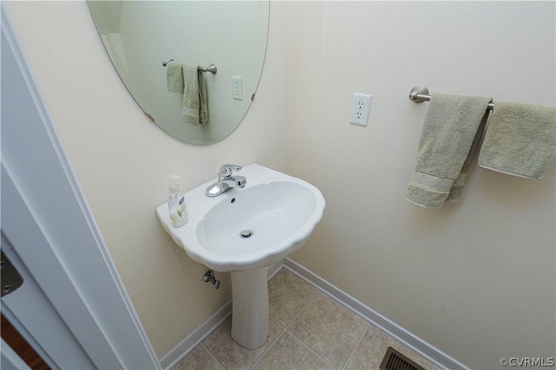 3901 Hazelnut Branch Road Midlothian, VA 23112 - Photo 49 of 50 a bathroom with a sink and mirror