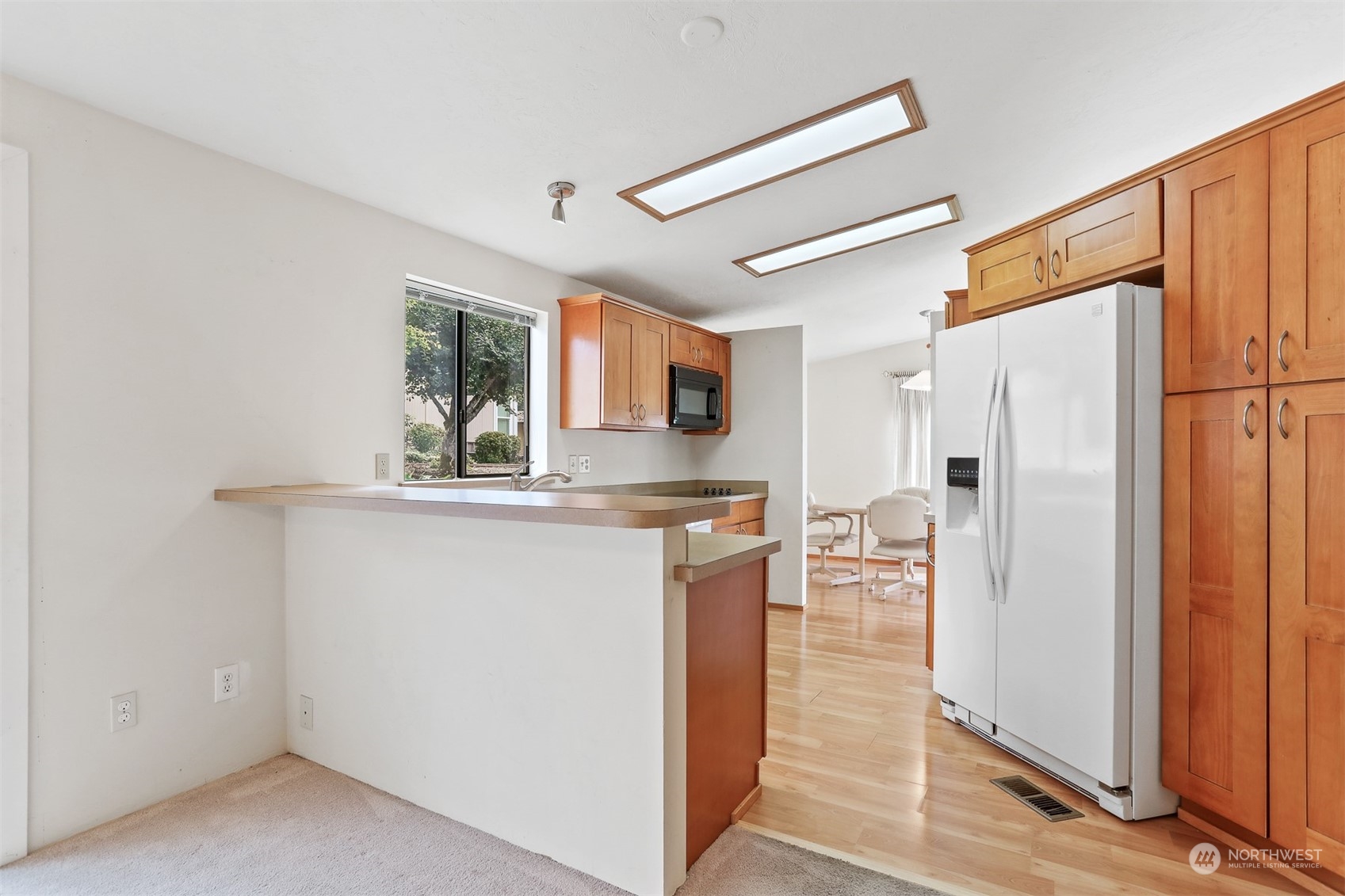 828 240th Place Southwest Bothell, WA 98021 - Photo 11 of 40 a kitchen with stainless steel appliances a refrigerator and a stove