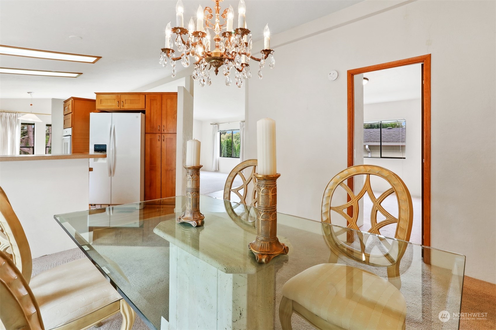 828 240th Place Southwest Bothell, WA 98021 - Photo 13 of 40 a view of a dining room with furniture and chandelier