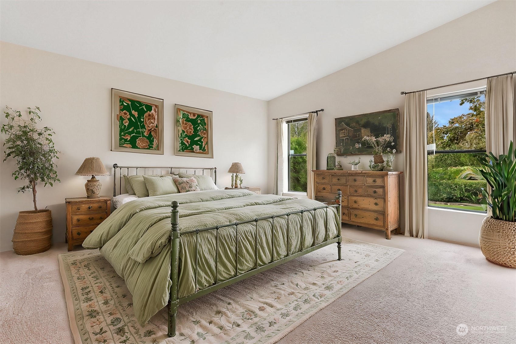 828 240th Place Southwest Bothell, WA 98021 - Photo 15 of 40 a bedroom with a large bed and a potted plant