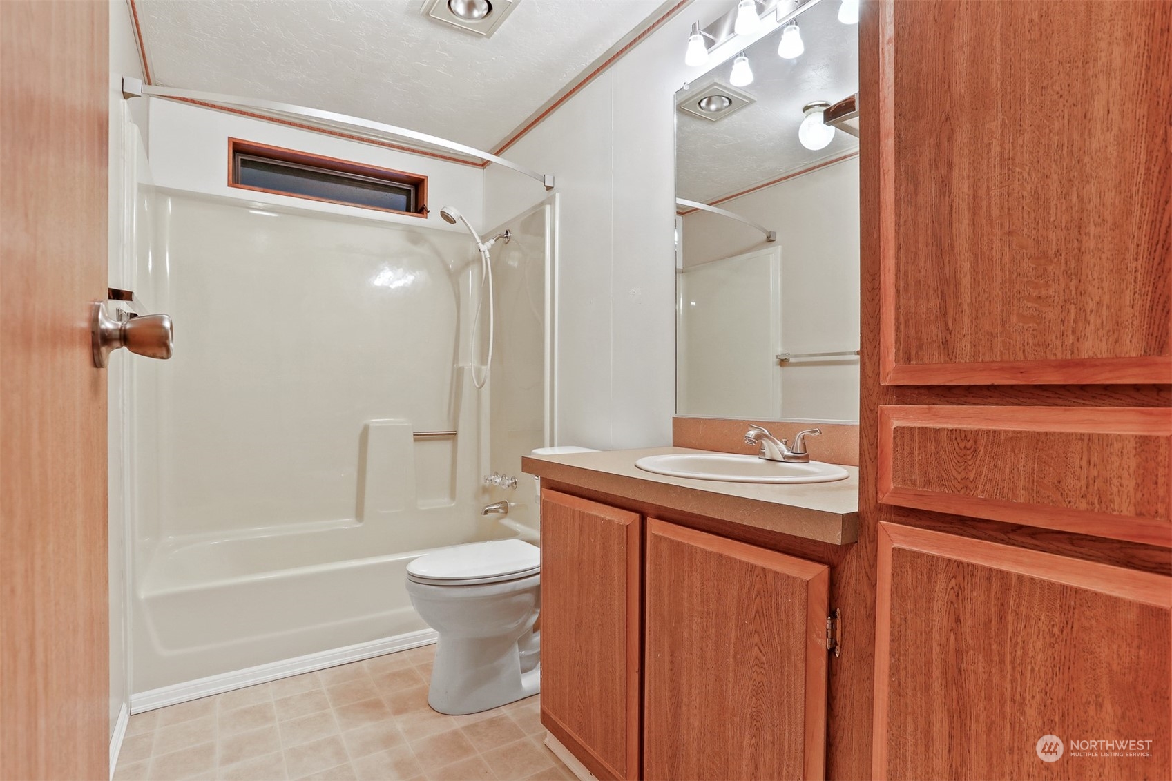 828 240th Place Southwest Bothell, WA 98021 - Photo 20 of 40 a bathroom with a granite countertop sink toilet and shower