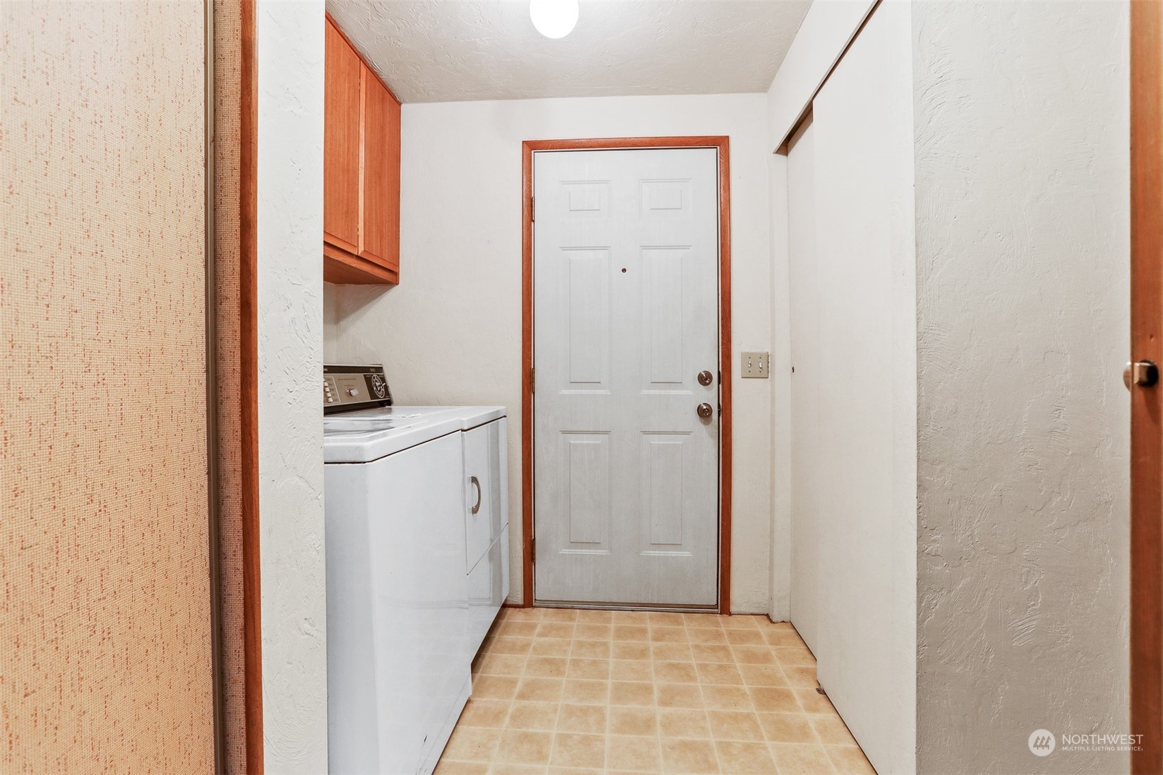828 240th Place Southwest Bothell, WA 98021 - Photo 22 of 40 a utility room with cabinets washer and dryer