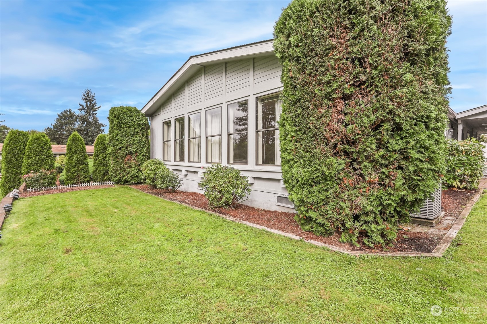 828 240th Place Southwest Bothell, WA 98021 - Photo 26 of 40 a front view of a house with garden