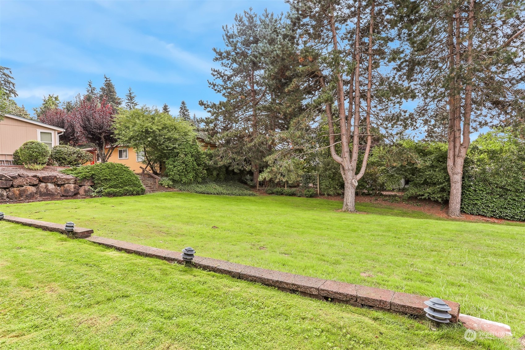 828 240th Place Southwest Bothell, WA 98021 - Photo 27 of 40 a view of yard with swimming pool and green space
