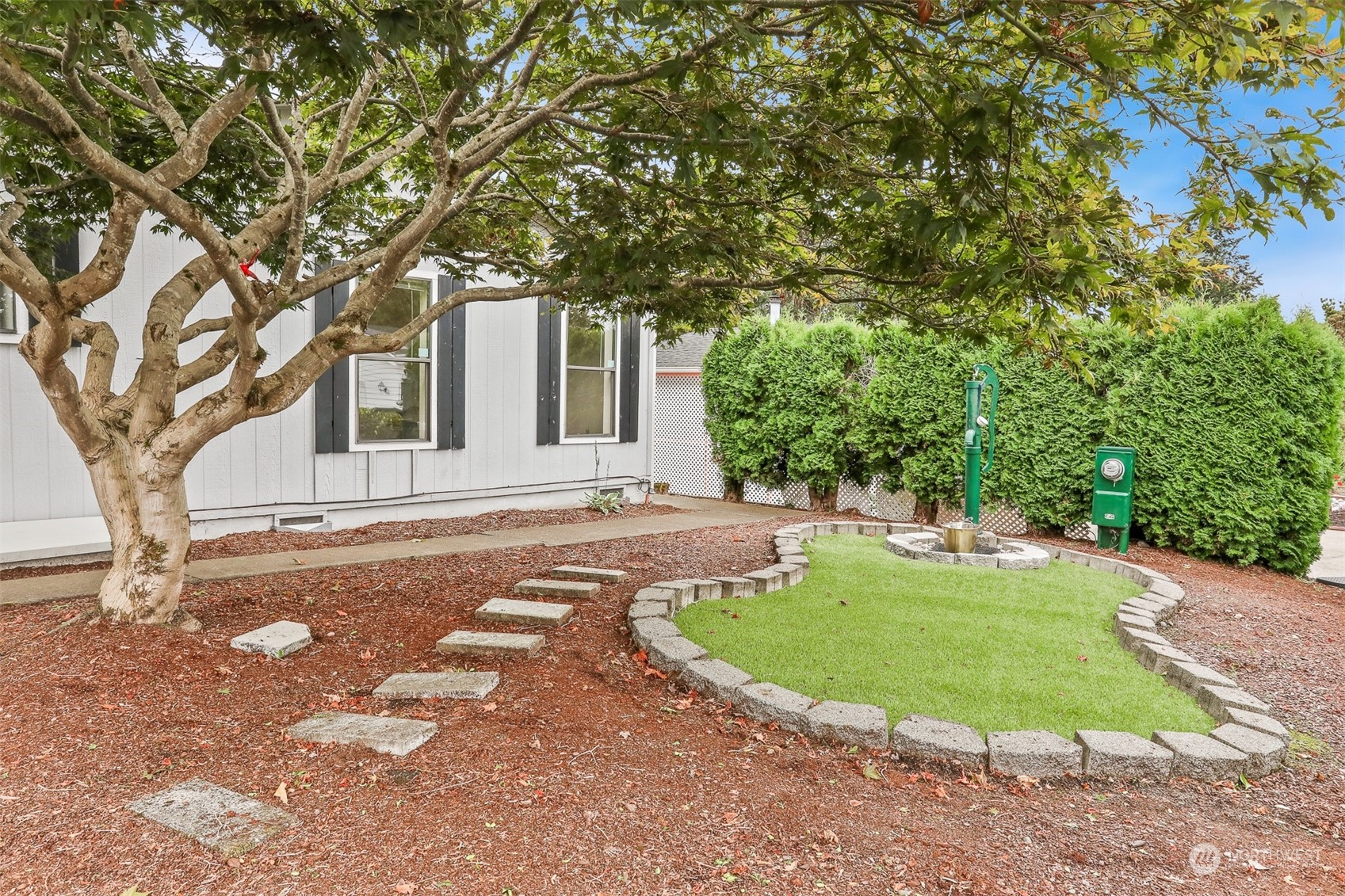 828 240th Place Southwest Bothell, WA 98021 - Photo 29 of 40 a front view of a house with a yard