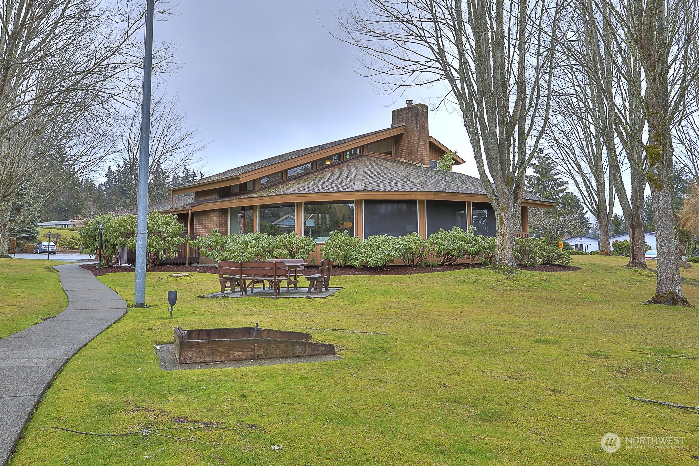 828 240th Place Southwest Bothell, WA 98021 - Photo 34 of 40 a view of a house with swimming pool and a yard