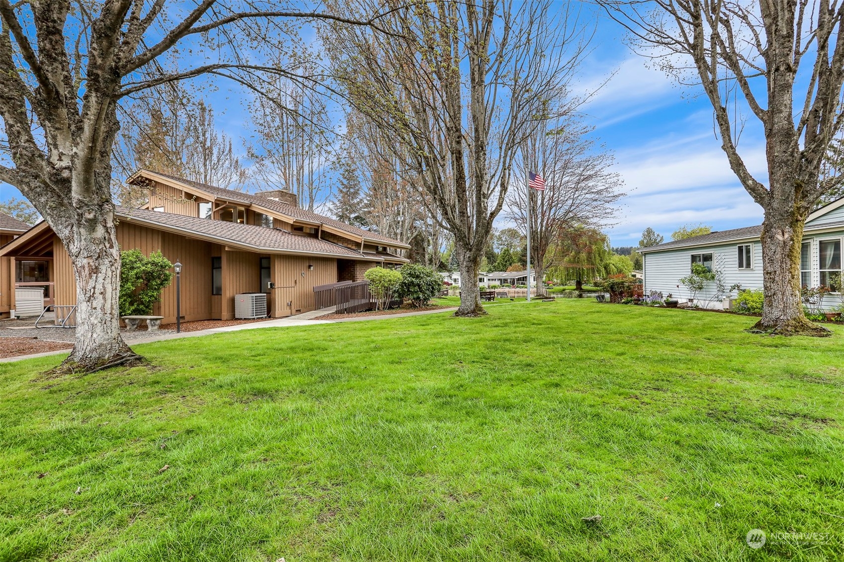 828 240th Place Southwest Bothell, WA 98021 - Photo 35 of 40 a view of a house with a yard