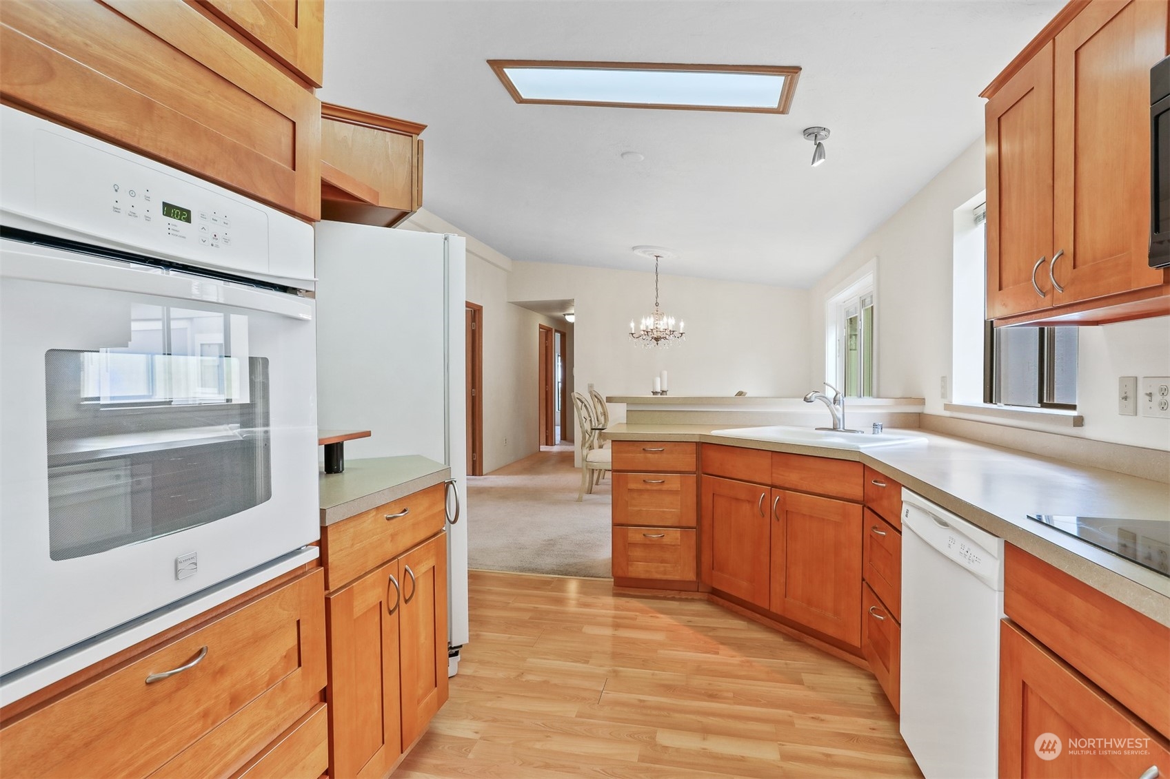 828 240th Place Southwest Bothell, WA 98021 - Photo 8 of 40 a large kitchen with stainless steel appliances granite countertop a large counter top a stove and a refrigerator