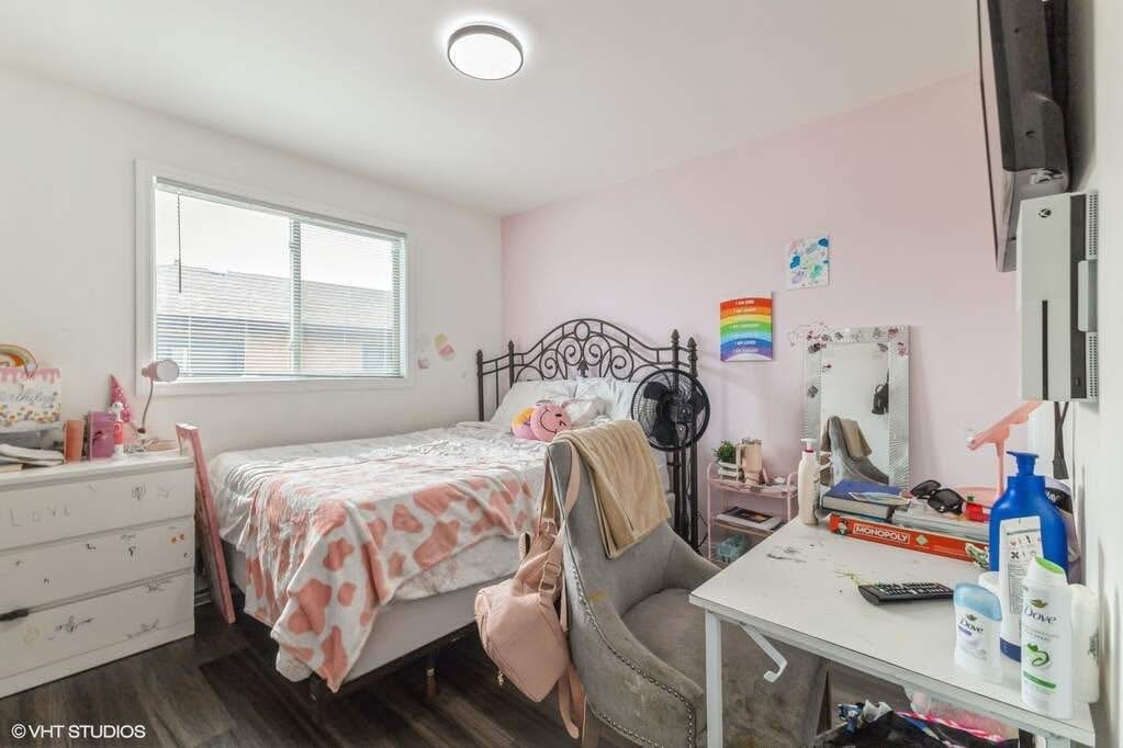 1119 Harding Avenue Calumet City, IL 60409 - Photo 8 of 11 a bedroom that has a bed and a tv in it
