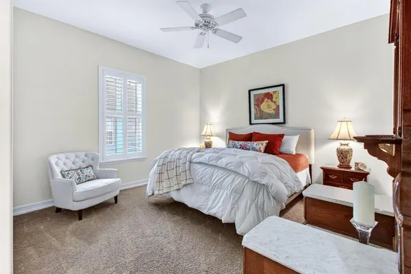 a bedroom with bed and window