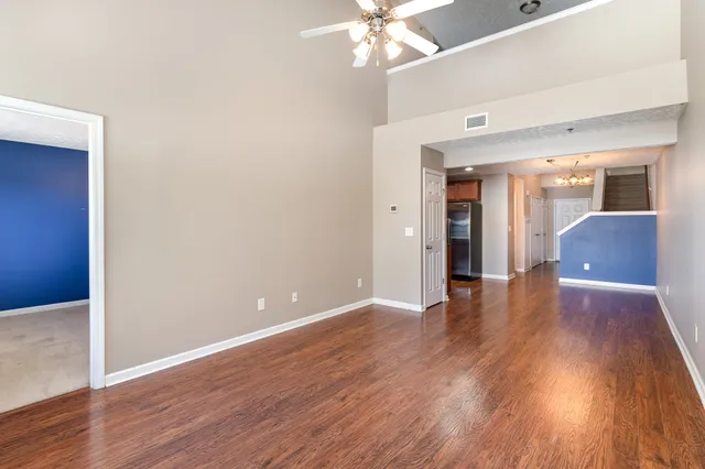 a view of livingroom with hardwood floor and ceiling fan