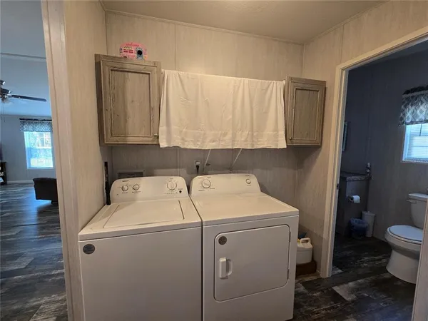 a utility room with dryer and washer