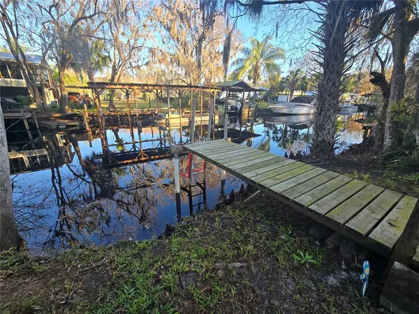 a view of a backyard with sitting area