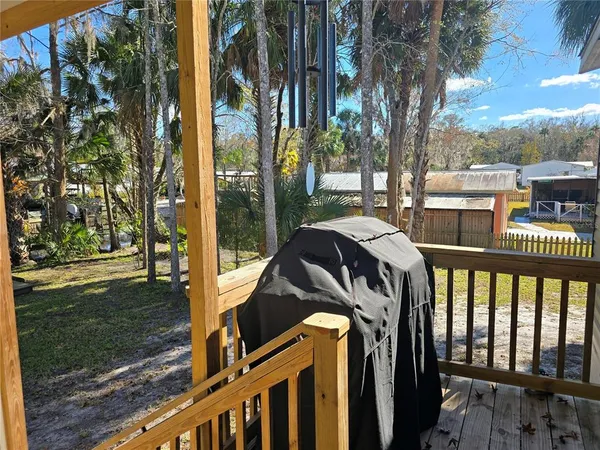 a view of balcony with two chairs and a table