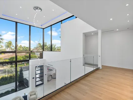 a bathroom with a shower sink and mirror