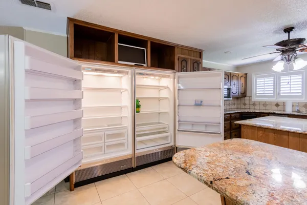 a view of an empty room with glass door