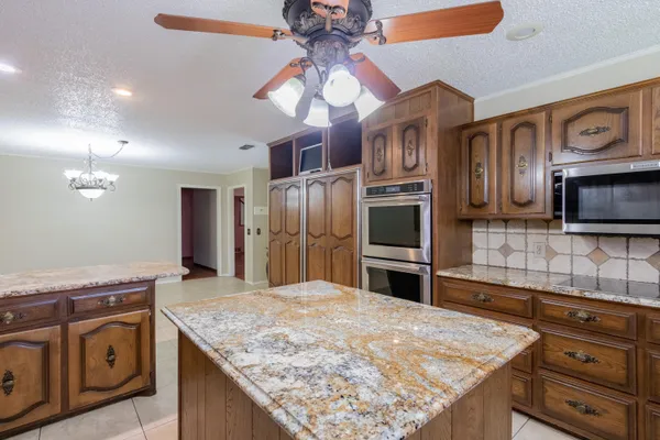 a view of an empty room with a bathroom