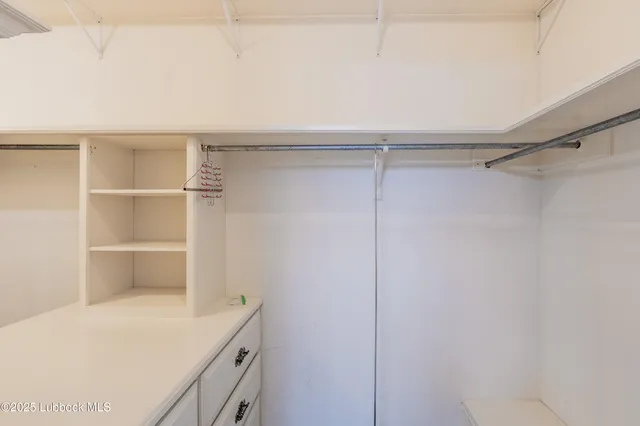 a view of an empty walk in closet