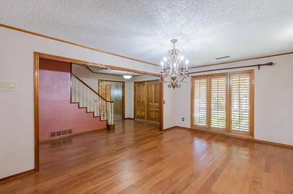 a large kitchen with stainless steel appliances granite countertop a stove a sink dishwasher and a refrigerator