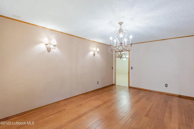 a large kitchen with a lot of cabinets and stainless steel appliances